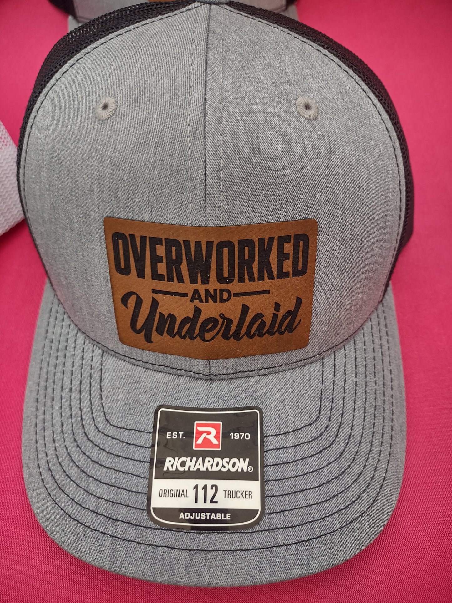 Overworked and underlaid hat